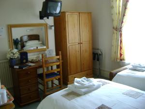 The Bedrooms at The Malvern Guesthouse and The Blues Grill