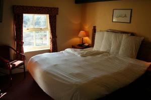 The Bedrooms at The Old Mill Hotel And 12th Century Restaurant