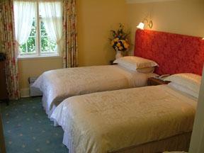 The Bedrooms at The Woodstock House Hotel - Guest House