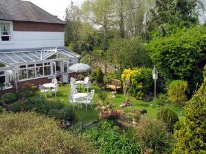 The Bedrooms at The Woodstock House Hotel - Guest House