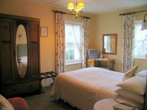 The Bedrooms at The Woodstock House Hotel - Guest House